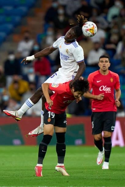 Eduardo Camavinga of Real Madrid CF battle for the ball with Kang-in Lee of RDC Mallorca during the La Liga Santander match between Real Madrid CF...