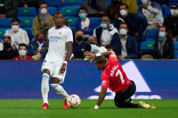 David Alaba of Real Madrid CF battle for the ball with Jordi Mboula of RDC Mallorca during the La Liga Santander match between Real Madrid CF and RCD...