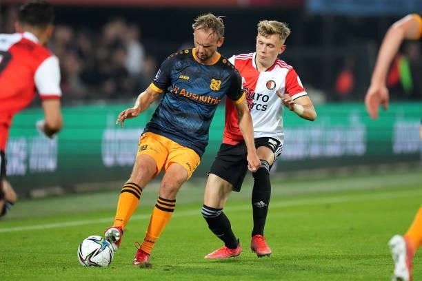 Siem de Jong of SC Heerenveen is challenged by Marcus Pedersen of Feyenoord during the Dutch Eredivisie match between Feyenoord and SC Heerenveen at...