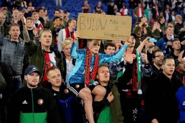 Fan of Feyenoord lift up a poster asking for the gloves of goalkeeper Justin Bijlow during the Dutch Eredivisie match between Feyenoord and SC...