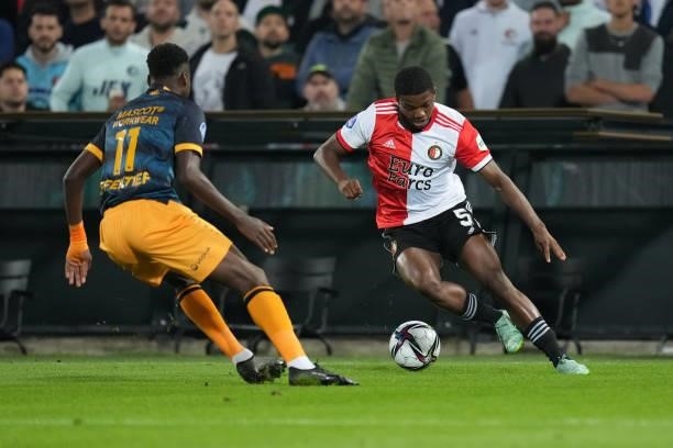 Anthony Musaba of SC Heerenveen challenges Tyrell Malacia of Feyenoord during the Dutch Eredivisie match between Feyenoord and SC Heerenveen at...