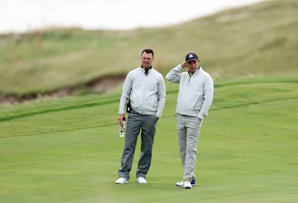 Vice-captain Martin Kaymer of Germany and team Europe and Captain Padraig Harrington of Ireland and team Europe look on during practice rounds prior...