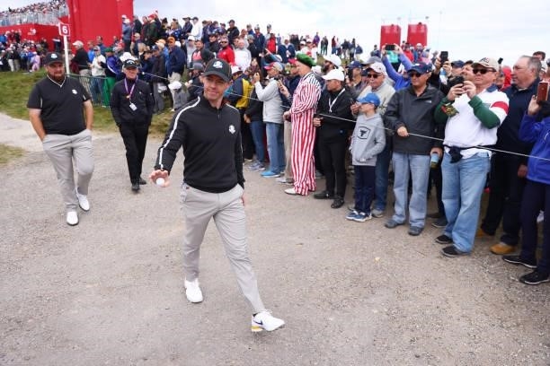 Rory McIlroy of Northern Ireland and team Europe waves to the crowd walking to the seventh tee during practice rounds prior to the 43rd Ryder Cup at...