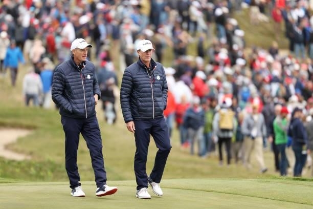 Vice-captain Jim Furyk of team United States and captain Steve Stricker of team United States walk across the course during practice rounds prior to...