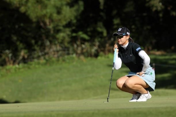 Yuri Yoshida of Japan lines up a putt on the 14th green during the first round of the Miyagi TV Cup Dunlop Ladies Open at Rifu Golf Club on September...