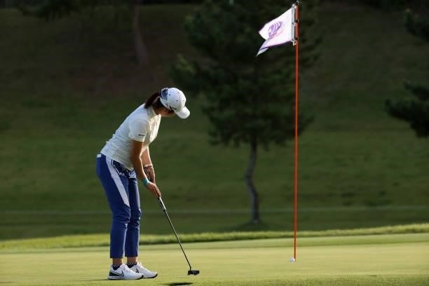 Momoko Osato of Japan holes the birdie putt on the 17th green during the first round of the Miyagi TV Cup Dunlop Ladies Open at Rifu Golf Club on...