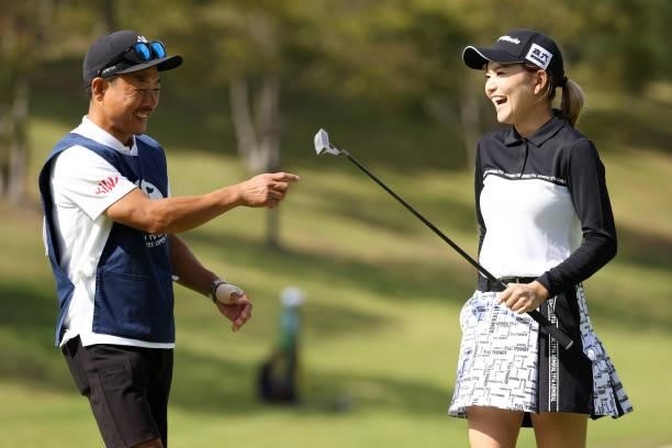 Akira Yamaji of Japan celebrates the birdie with her caddie on the 12th green during the first round of the Miyagi TV Cup Dunlop Ladies Open at Rifu...