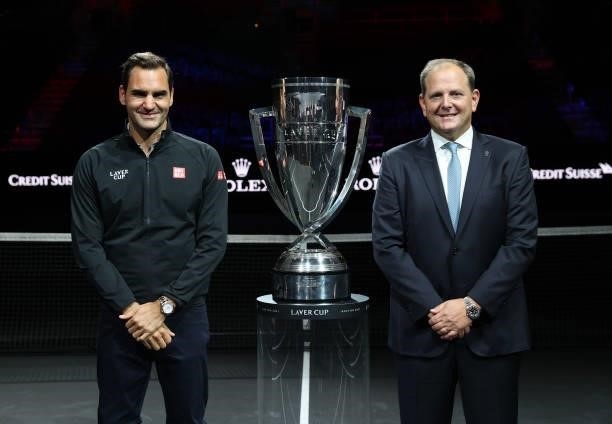Roger Federer and Laver Cup Chairman Tony Godsick pose for a photograph with the Laver Cup Trophy after taking part in a live TV interview on CNBC at...