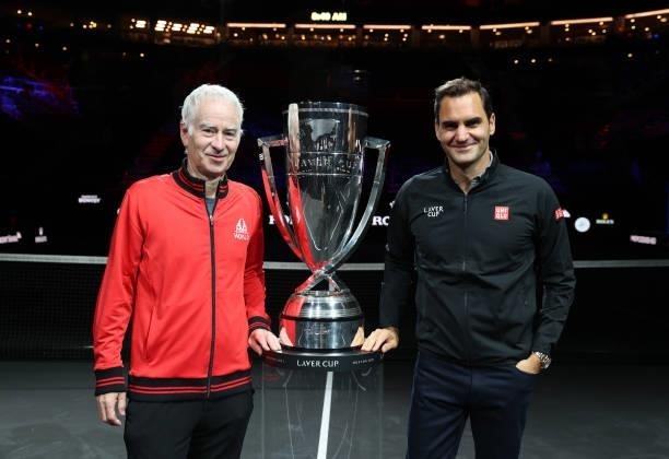 John McEnroe Team World Captain and Roger Federer pose for a photograph with the Laver Cup Trophy after taking part in a live TV interview on CNBC at...
