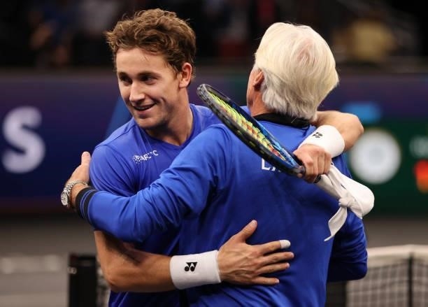 Casper Ruud of Team Europe celebrates his match point over Reilly Opelka of Team World with Team Europe Captain Björn Borg during the first match...