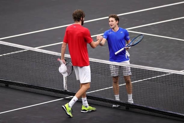 Reilly Opelka of Team World shakes hands with Casper Ruud of Team Europe after the first match during Day 1 of the 2021 Laver Cup at TD Garden on...