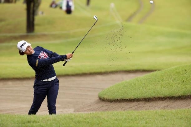 Mamiko Higa of Japan hits out from a bunker on the 1st hole during the second round of the Miyagi TV Cup Dunlop Ladies Open at Rifu Golf Club on...