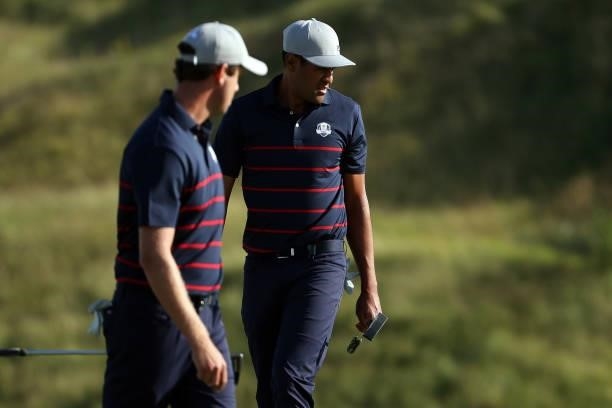 Tony Finau of team United States and Harris English of team United States look on over the 12th green during Friday Afternoon Fourball Matches of the...