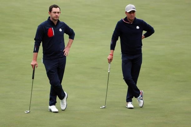 Paul Casey of England and team Europe and Justin Thomas of team United States look on during Friday Afternoon Fourball Matches of the 43rd Ryder Cup...