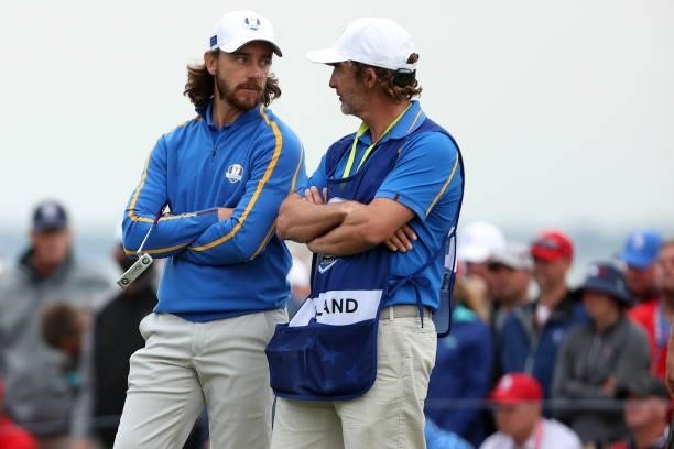 Tommy Fleetwood of England and team Europe talks with his partners caddie Shay Knight during Friday Afternoon Fourball Matches of the 43rd Ryder Cup...