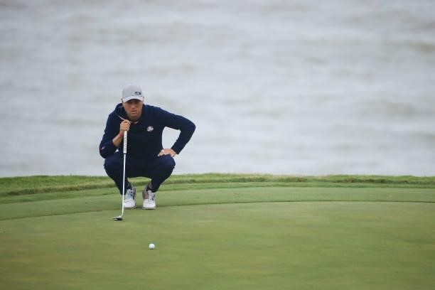 Justin Thomas of team United States lines up a putt on the 17th green during Friday Afternoon Fourball Matches of the 43rd Ryder Cup at Whistling...