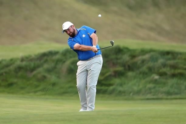 Shane Lowry of Ireland and team Europe plays a shot during Friday Afternoon Fourball Matches of the 43rd Ryder Cup at Whistling Straits on September...