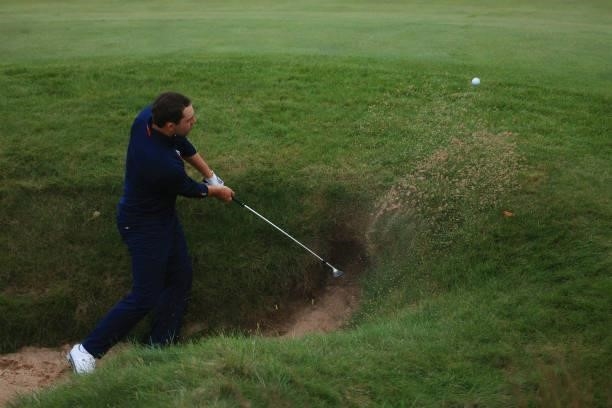 Patrick Cantlay of team United States plays a shot from a bunker on the 18th hole during Friday Afternoon Fourball Matches of the 43rd Ryder Cup at...