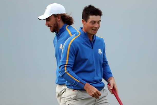 Tommy Fleetwood of England and team Europe and Viktor Hovland of Norway and team Europe look on during Friday Afternoon Fourball Matches of the 43rd...