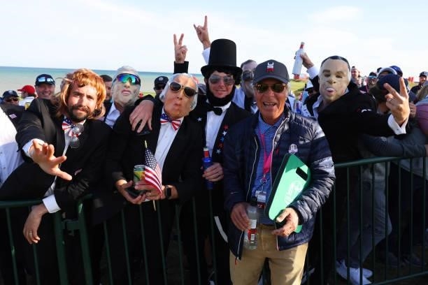 Former USA Ryder Cup captain Ben Crenshaw poses with fans dressed up as US Presidents during Friday Afternoon Fourball Matches of the 43rd Ryder Cup...