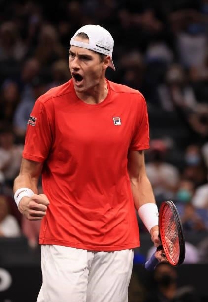 John Isner of Team World play a shot against Alexander Zverev and Matteo Berrettini of Team Europe during the fourth match in the fourth match during...