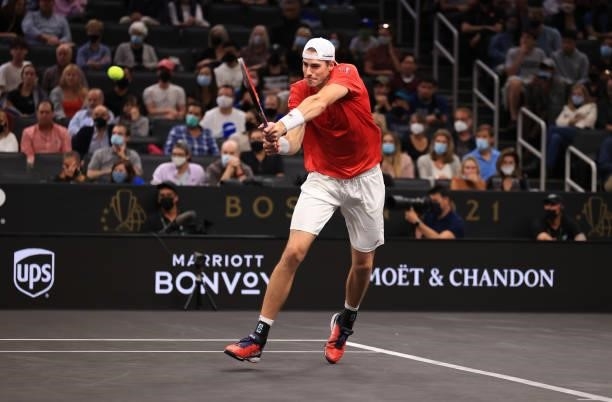 John Isner of Team World plays a shot against Alexander Zverev and Matteo Berrettini of Team Europe during the fourth match in the fourth match...