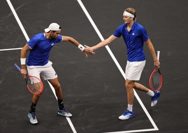 Alexander Zverev and Matteo Berrettini of Team Europe react after a shot against John Isner and Denis Shapovalov of Team World in the fourth match...