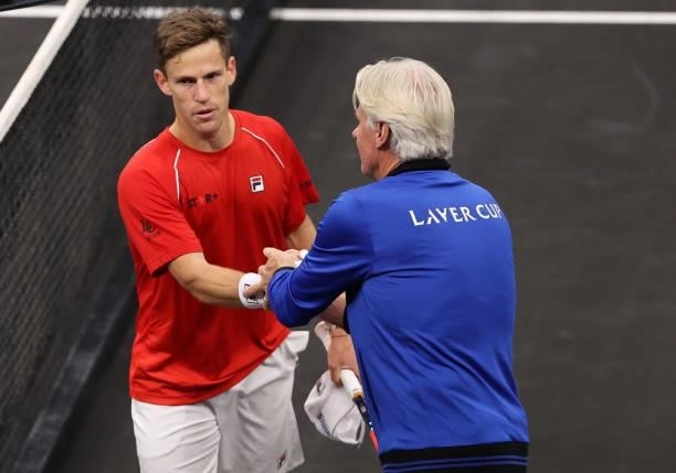 Team Europe Captain Björn Borg shakes hands with Diego Schwartzman of Team World after the third match during Day 1 of the 2021 Laver Cup at TD...