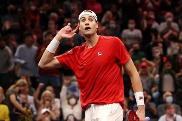 John Isner of Team World reacts during a doubles match against Alexander Zverev and Matteo Berrettini of Team Europe during Day 1 of the 2021 Laver...