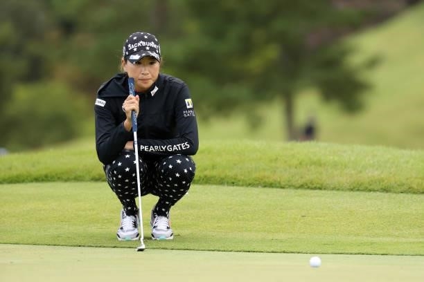 Megumi Kido of Japan lines up a putt on the 18th green during the second round of the Miyagi TV Cup Dunlop Ladies Open at Rifu Golf Club on September...