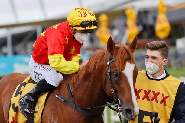 Tim Clark on In The Congo returns to scale after winning race 8 the XXXX Golden Rose during Sydney Racing on Golden Rose Day at Rosehill Gardens on...