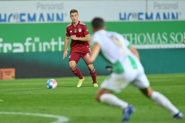 Joshua Kimmich of FC Bayern Muenchen plays the ball during the Bundesliga match between SpVgg Greuther Fürth and FC Bayern München at Sportpark...