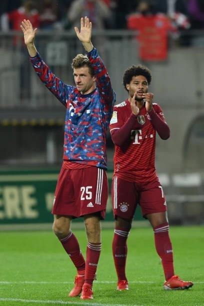 Thomas Mueller and Serge Gnabry of FC Bayern Muenchen wave to their fans after the Bundesliga match between SpVgg Greuther Fürth and FC Bayern...
