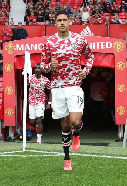 Raphael Varane of Manchester United warms up ahead of the Premier League match between Manchester United and Aston Villa at Old Trafford on September...