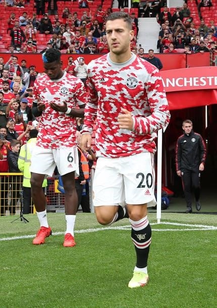 Diogo Dalot of Manchester United warms up ahead of the Premier League match between Manchester United and Aston Villa at Old Trafford on September...