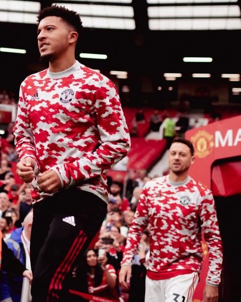 Jadon Sancho and Nemanja Matic of Manchester United warms up ahead of the Premier League match between Manchester United and Aston Villa at Old...