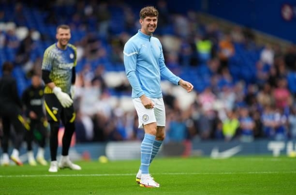 John Stones of Manchester City warms up prior to the Premier League match between Chelsea and Manchester City at Stamford Bridge on September 25,...