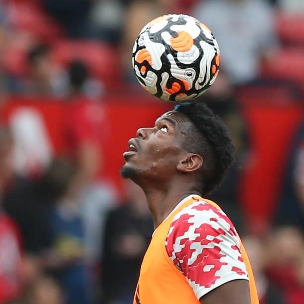 Paul Pogba of Manchester United warms up ahead of the Premier League match between Manchester United and Aston Villa at Old Trafford on September 25,...