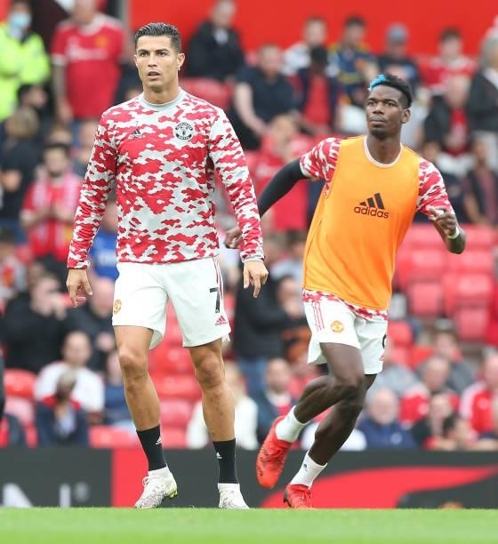 Cristiano Ronaldo and Paul Pogba of Manchester United warms up ahead of the Premier League match between Manchester United and Aston Villa at Old...