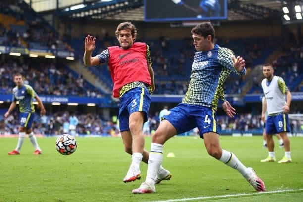 Andreas Christensen of Chelsea warms up with Marcos Alonso of Chelsea prior to the Premier League match between Chelsea and Manchester City at...