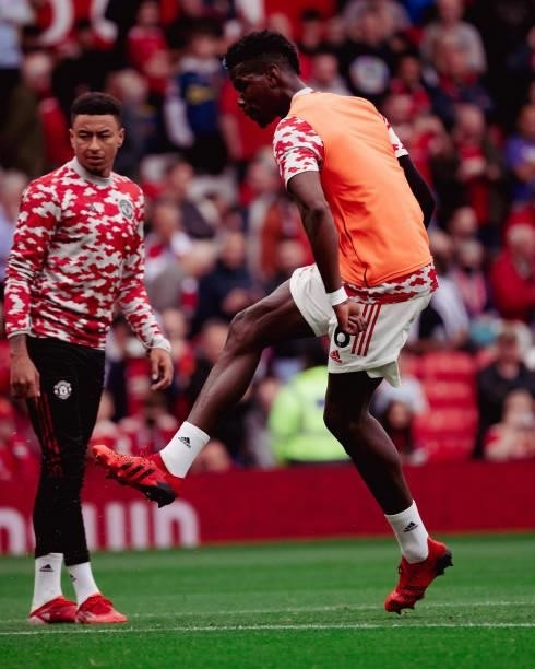 Paul Pogba and Jesse Lingard of Manchester United warms up ahead of the Premier League match between Manchester United and Aston Villa at Old...