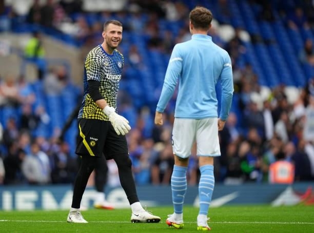 Marcus Bettinelli of Chelsea interacts with John Stones of Manchester City prior to the Premier League match between Chelsea and Manchester City at...