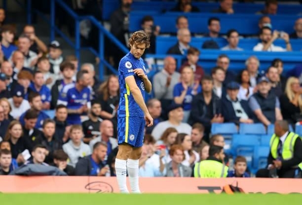 Marcos Alonso of Chelsea points to the say no to racism badge on his shirt as other players take the knee in support of the Black Lives Matter...