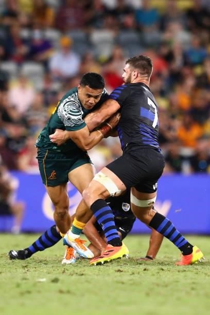 Len Ikitau of the Wallabies is tackled during The Rugby Championship match between the Australian Wallabies and Argentina Pumas at QCB Stadium on...