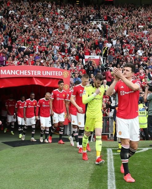 Harry Maguire of Manchester United leads the team out ahead of the Premier League match between Manchester United and Aston Villa at Old Trafford on...