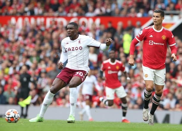 Cristiano Ronaldo of Manchester United in action with Matt Targett of Aston Villa during the Premier League match between Manchester United and Aston...