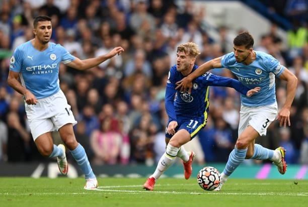 Timo Werner of Chelsea battles for possession with Ruben Dias of Manchester City during the Premier League match between Chelsea and Manchester City...