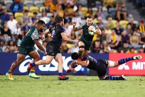 Nic White of the Wallabies is tackled during The Rugby Championship match between the Australian Wallabies and Argentina Pumas at QCB Stadium on...