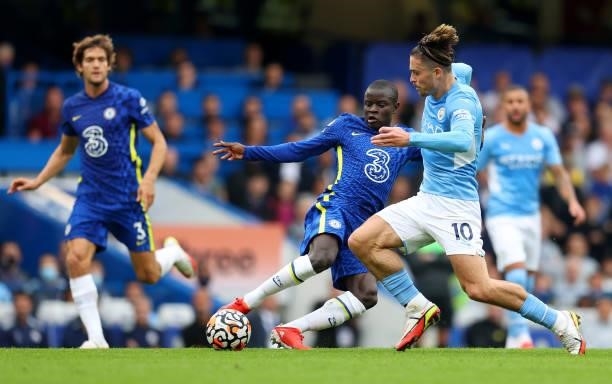 Ngolo Kante of Chelsea tackles Jack Grealish of Manchester City during the Premier League match between Chelsea and Manchester City at Stamford...