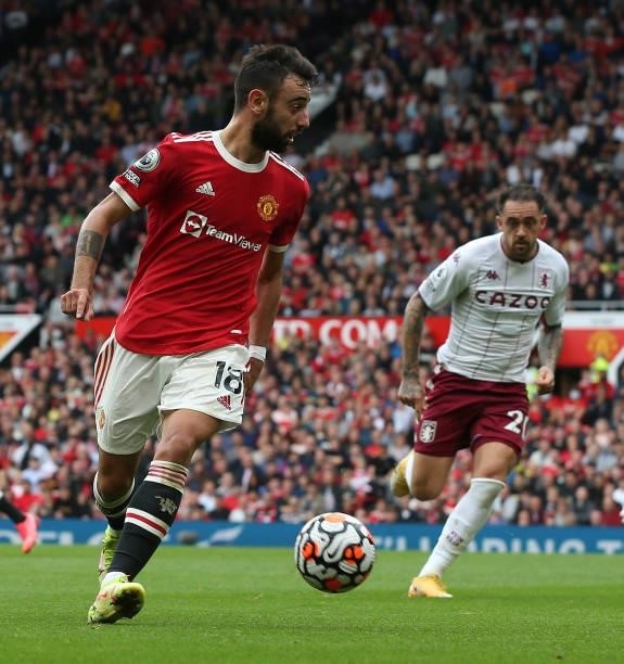 Bruno Fernandes of Manchester United in action with Danny Ings of Aston Villa during the Premier League match between Manchester United and Aston...